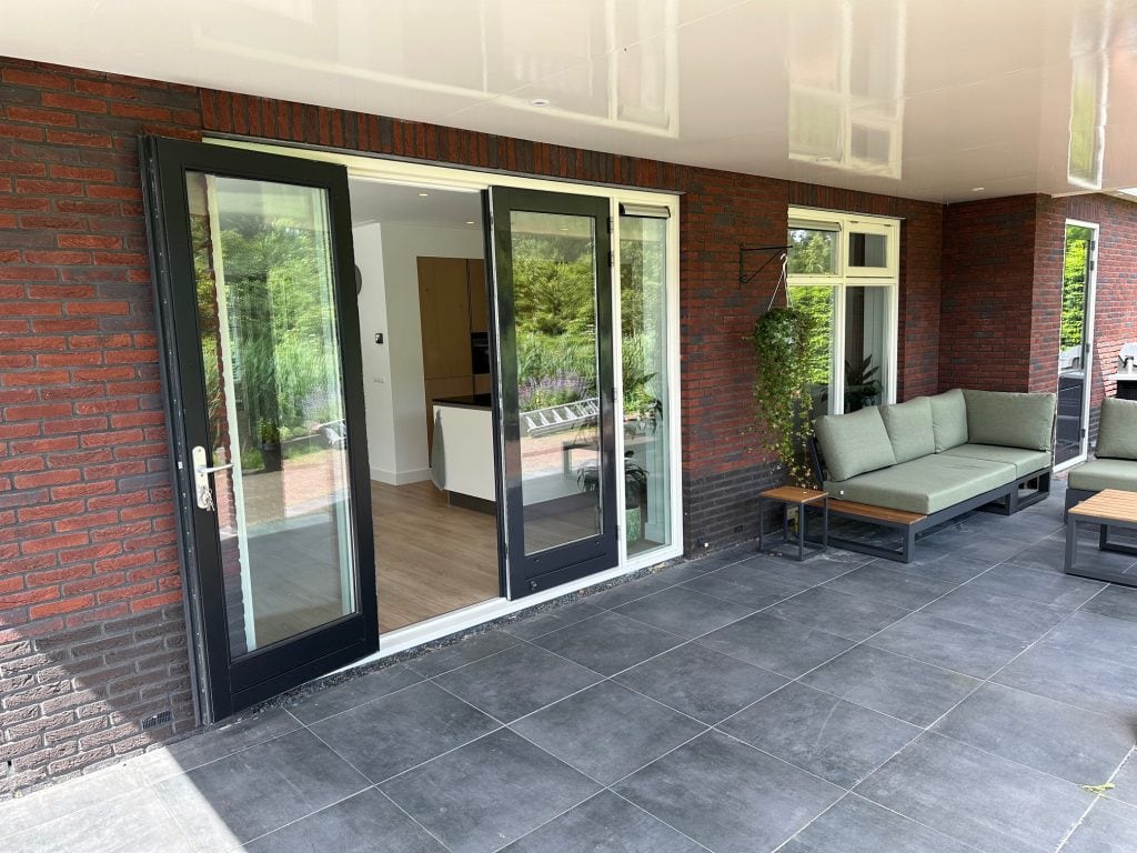 Spacious outdoor patio with glass sliding doors at Almere Nobelhorst.