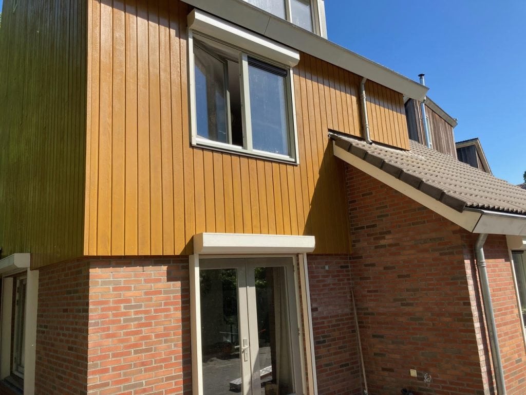 Schilderwerk woning Almere Haven — voor- en achtergevels